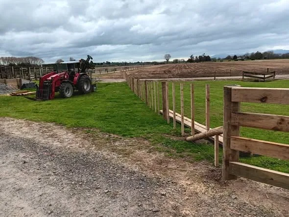 Post and batten rural fencing along a farm road